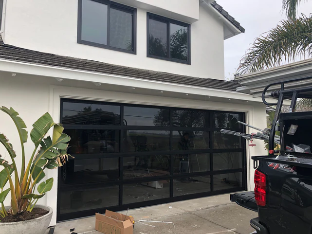 Contemporary Black Aluminum & Gray Tinted (See Through) Glass Garage Door